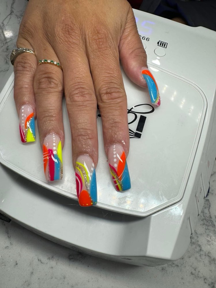 Long square acrylics with bold neon multicolor swirls and glitter accents